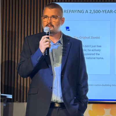 Tom Wegner speaking at a presentation